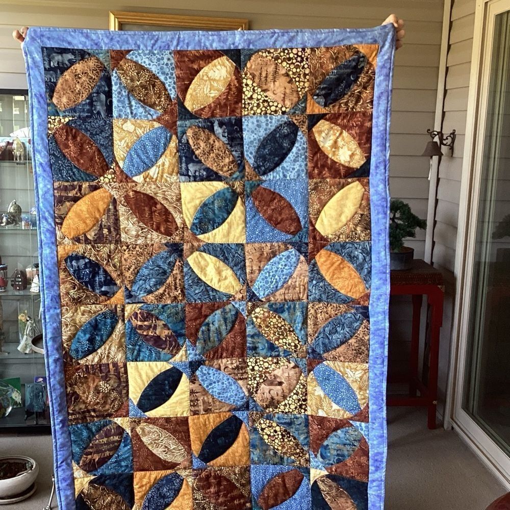 Patchwork Quilt with Blue and Brown Tones